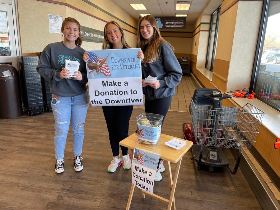 Woodhaven+Deca+students+Mackenzie+Murphy%2C+Jalynn+Wilmot%2C+Lilly+Rushlow%2C+were+at+the+food+drive+helping+out+with+donations+to+raise+money+for+our+veterans.+
