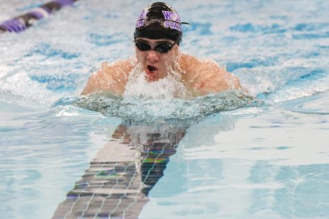 Parker Shope is hard to catch as he blades through the 100 Y breaststroke.
