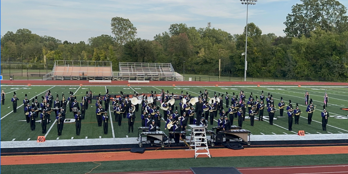 The+marching+band+takes+the+field+for+their+performance+at+Belleville.+