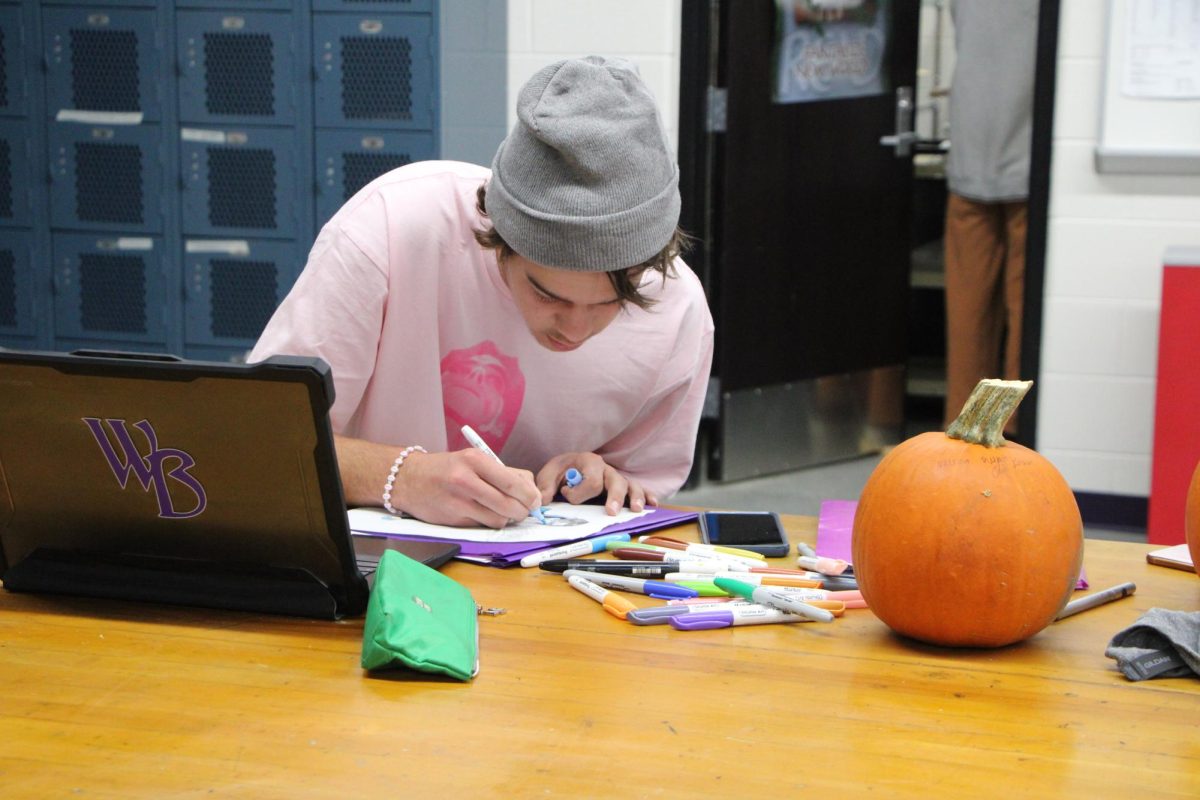 Wyatt Braun works on Inktober drawings,