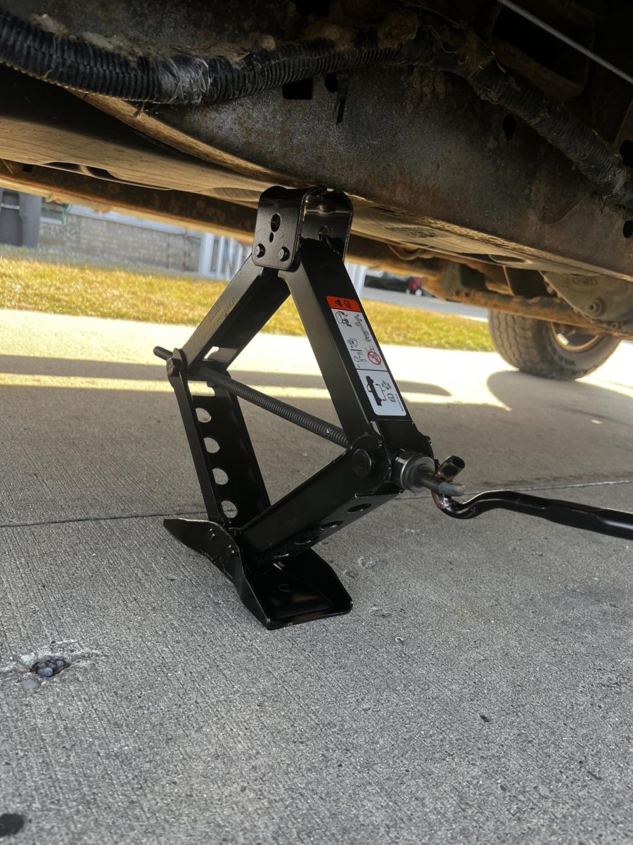 Place the jack under the rocker panel pinch welds or the frame, there are typically 4 points to place the jack.