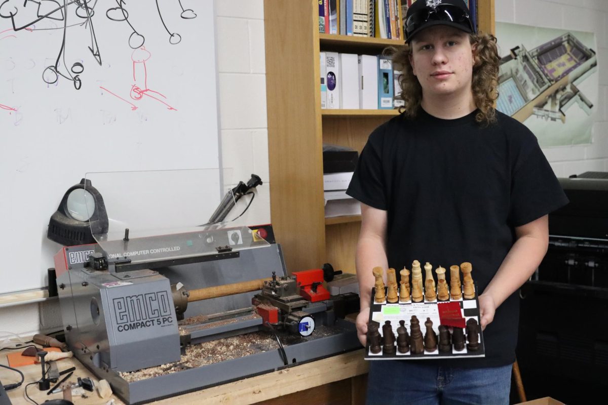 Sophomore Joseph Berry shows his award-winning CAD project. Berry’s project is a chess set made from various types of wood, which he machined on the CNC lathe, spray painted, and sent off to the competition. Berry described how meticulously everything had to be set up to avoid the pieces breaking when using the machine, but he didn’t let those difficulties stop him from placing 2nd in the state competition. 